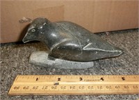 carved stone bird figure tip of beak is chipped