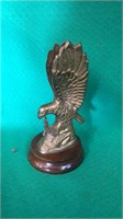 Brass eagle on a wooden base