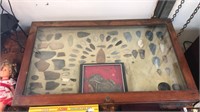 Large display of arrow heads, pottery pieces and