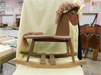 Wooden child's rocking horse with yarn mane and