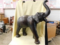 Large leather covered elephant statue with one
