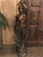 Bronze Woman standing. 64x12.