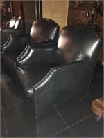 Pair of leather lounge chairs.