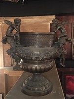 Bronze pot w/angels and lion heads, approx 30x25