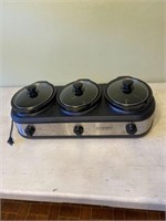 Three smaller crockpots and one unit