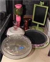 plates, candle holders and mini blackboard