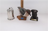 duck and dog statues with duck metal mug