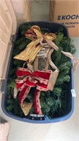 Bin of garland and other Christmas decorations