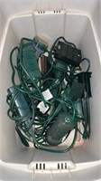 Bin of outdoor extension cords and timers