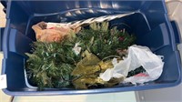 Bin of assorted Christmas decorations