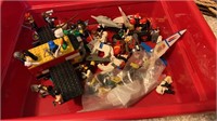 Bin of legos with many figures including Star