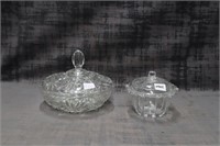 2 lidded glass dishes
