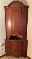 Antique bow front corner cabinet in two