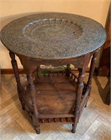 Antique table from India with a silver tone and