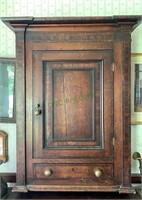 Antique English oak wall cabinet with a paneled