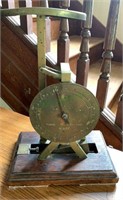 Antique brass parcel post weight scale on a oak