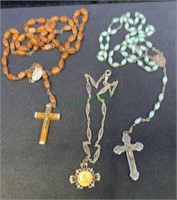 Two vintage rosaries and a religious theme