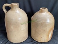 Lot of two antique pottery crock jugs - tallest is