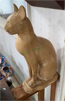Carved wooden cat figurine stands 18 inches tall