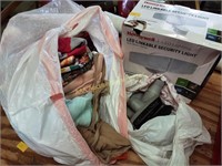 Assorted women’s clothing, vacuum attachments,