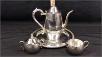 Oneida silver teapot, sugar bowl and creamer, and