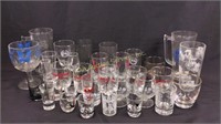 Assortment of glasses, glass shot glasses, one