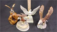 Four eagle statuettes