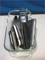 Baking dish of many old cell phones no cords