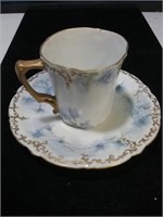 Unmarked demitasse porcelain cup and saucer