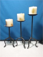 Set of three metal graduated size candle holders