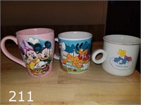 Vintage coffee cups including Care Bears & Disney