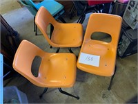 Mid century orange chairs