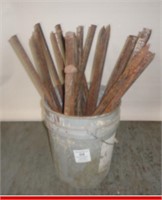 Bucket full of cement form stakes