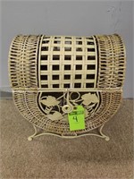 Wicker and metal stoarage basket on legs.