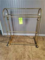 Brass quilt rack.