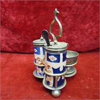 Silver plate/pottery condiment caddy.