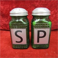 Salt & pepper green glass shakers.