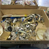 Assorted watch parts pieces.