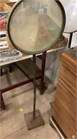 Circular standing mirror