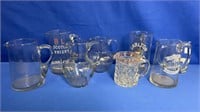 8 ASSORTED EARLY ADVERTISING WHISKY JUGS.