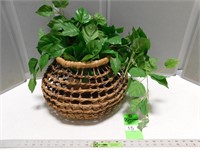 Faux greenery in a basket