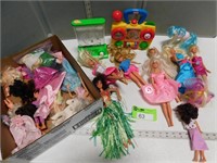 Barbies, other assorted dolls, water game, busy to