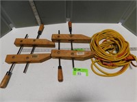 2 Wooden clamps and an extension cord