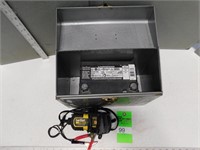 12 Volt battery with a charger in a metal case