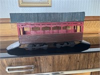 Handmade train car constructed with matchsticks.