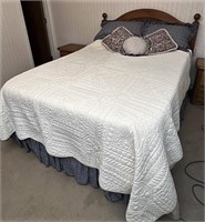 Queen size bed with linens