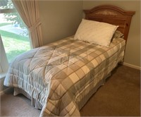 Twin size bed with linens
