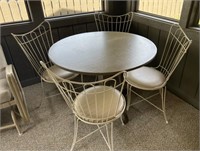 Table with ice cream parlor metal chairs