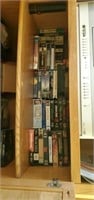VHS movie collection top shelf only - living room