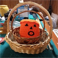 2 wicker baskets and crocheted pumpkin